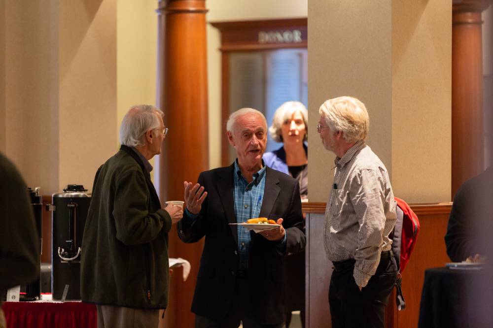 People connect over a bite to eat before the Arnold C. Ott lecture, Oct 4